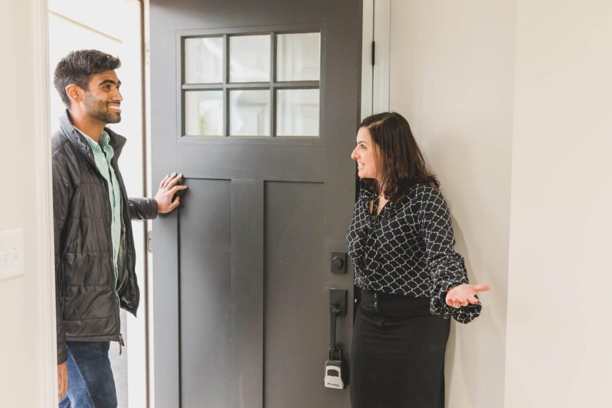 Realtor welcoming a prospective home owner