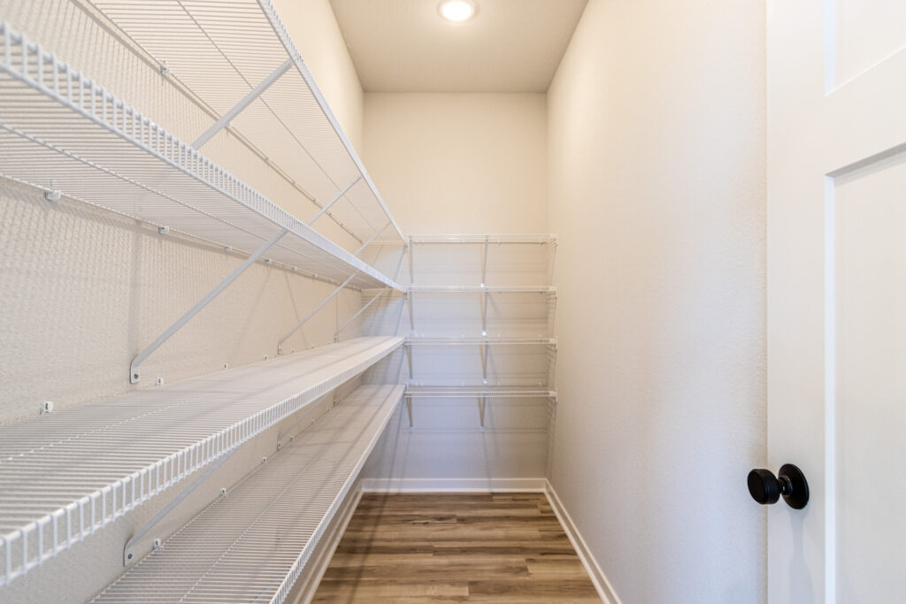 The Prescott Kitchen Walk-In Pantry by Stepping Stone Homes Wisconsin