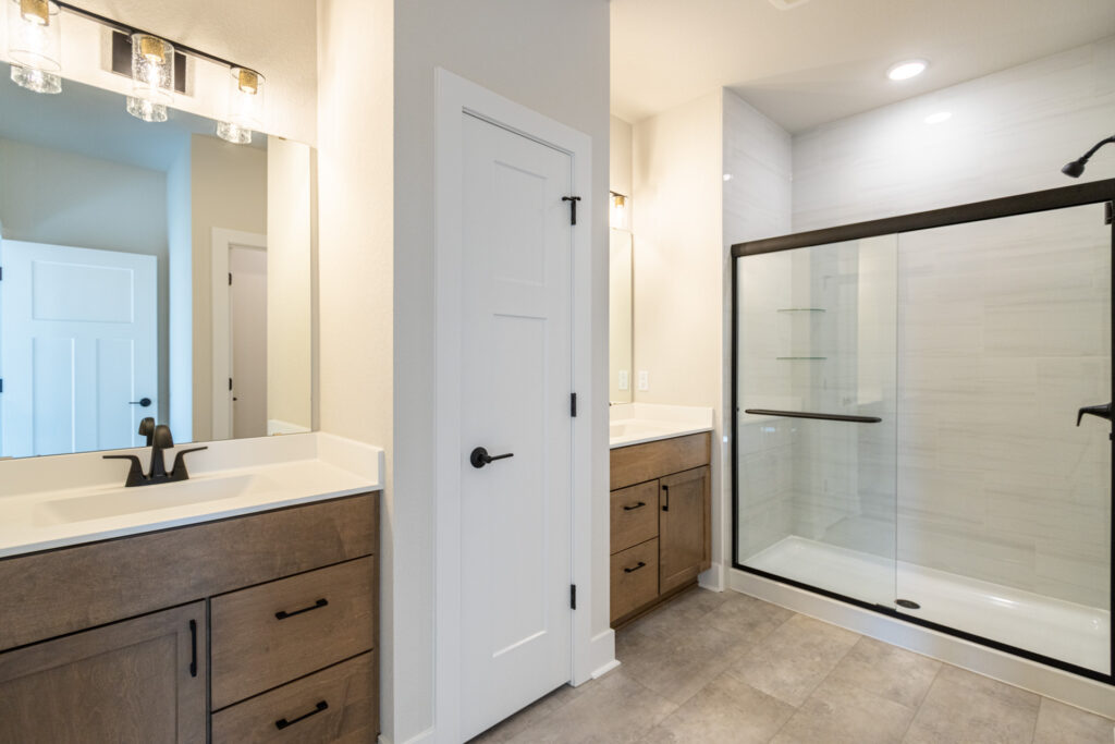 The Lauren Master Bathroom by Stepping Stone Homes