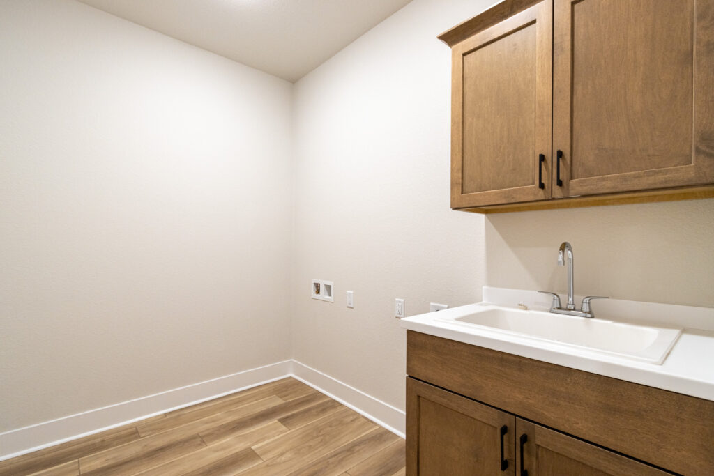 The Lauren Laundry Room by Stepping Stone Homes