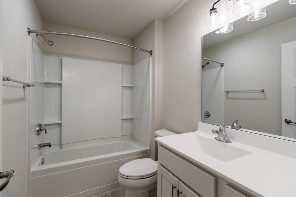 The Seven Pines Condo Bathroom by Stepping Stone Homes