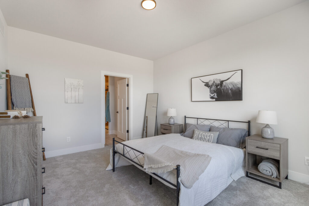 The Juniper Duplex Master Bedroom by Stepping Stone Homes