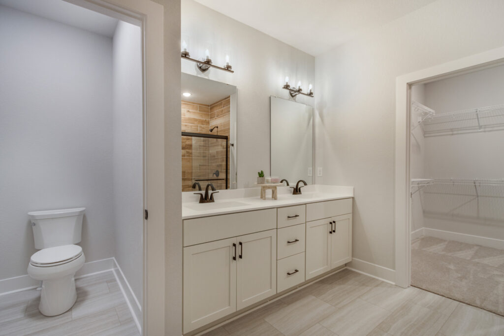 The Juniper Duplex Master Bathroom by Stepping Stone Homes