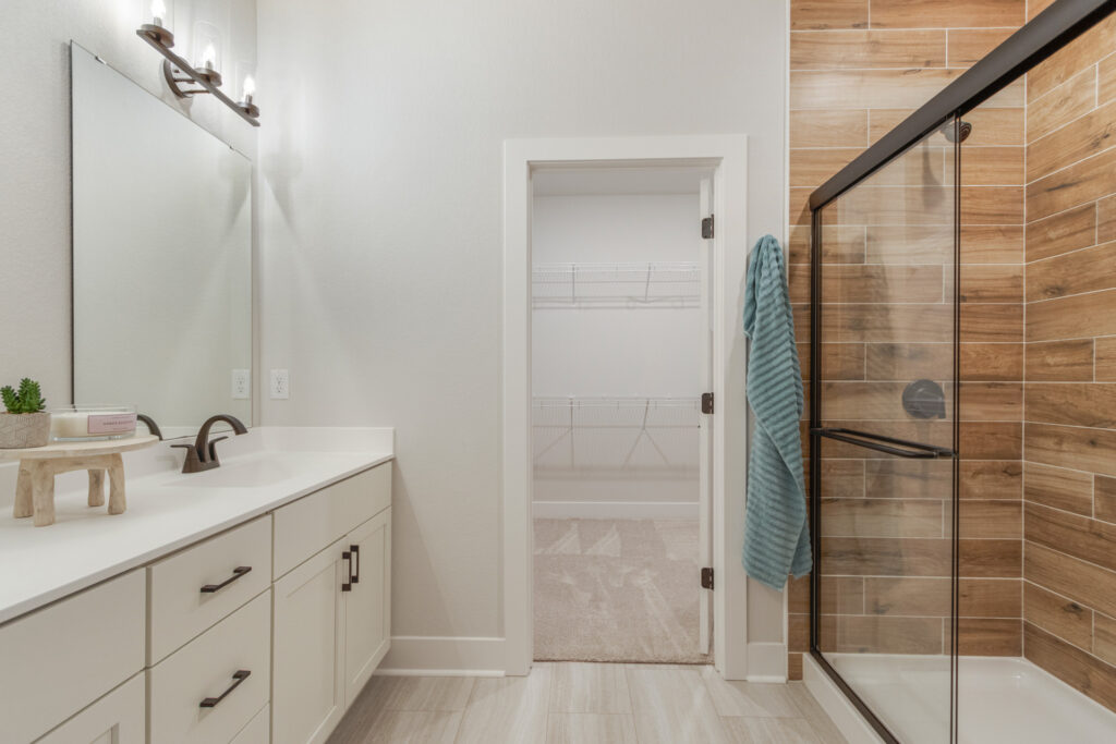 The Juniper Duplex Master Bathroom by Stepping Stone Homes