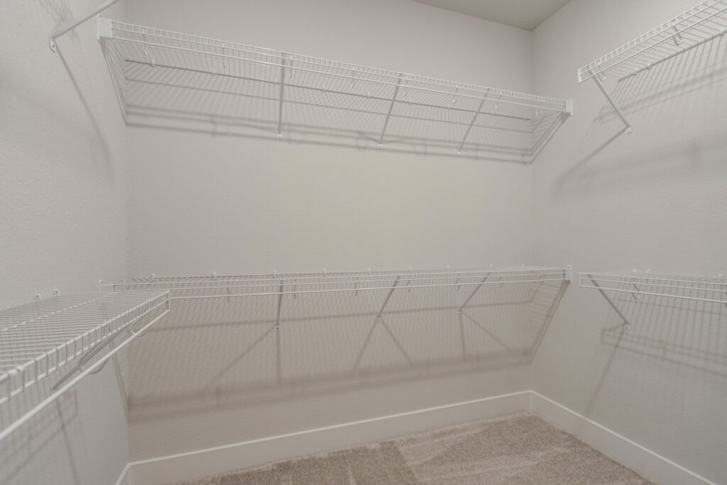 The Juniper Duplex Walk-In Closet by Stepping Stone Homes