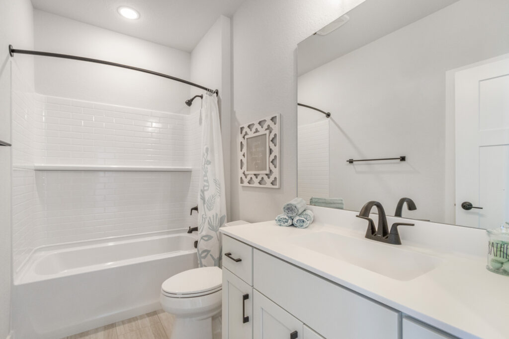The Juniper Duplex Bathroom by Stepping Stone Homes