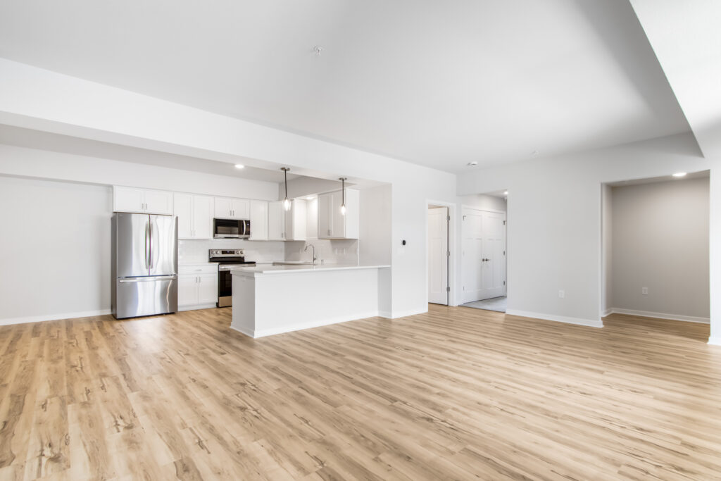 Edgewood Meadows Lower Condo Great Room by Stepping Stone Homes