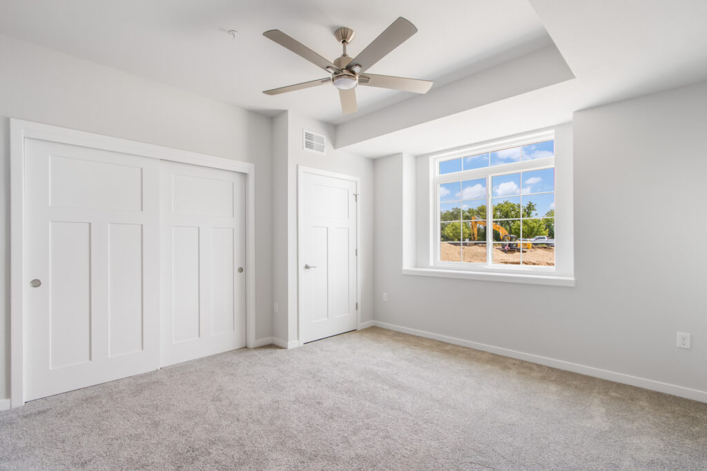 Edgewood Meadows Lower Condo Master Bedroom by Stepping Stone Homes