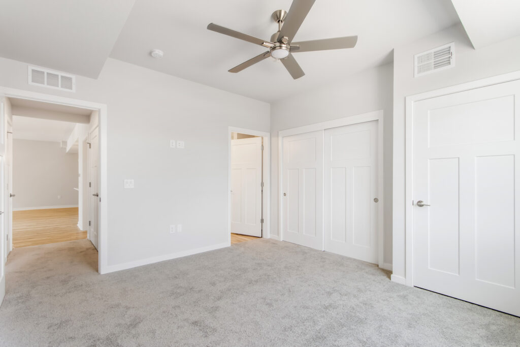 Edgewood Meadows Lower Condo Master Bedroom by Stepping Stone Homes