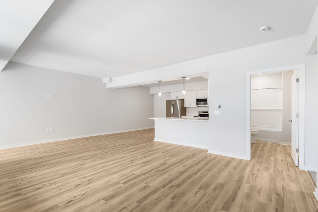 Edgewood Meadows Lower Condo Great Room by Stepping Stone Homes