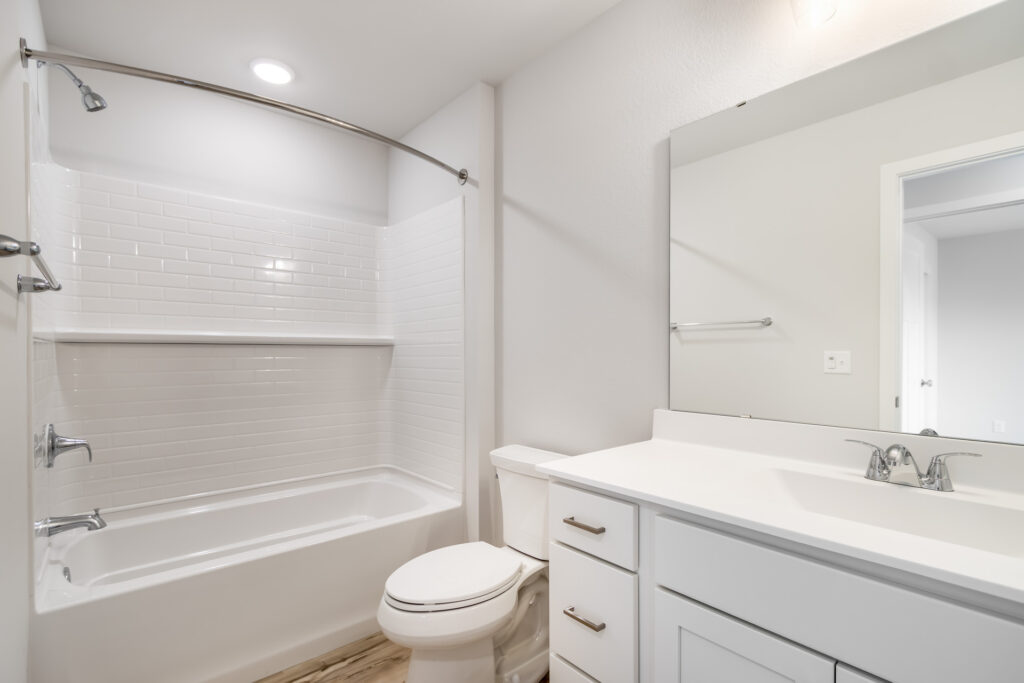 The Pine Bathroom by Stepping Stone Homes