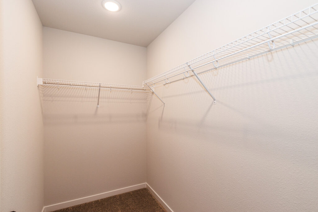 The Linden Master Closet by Stepping Stone Homes