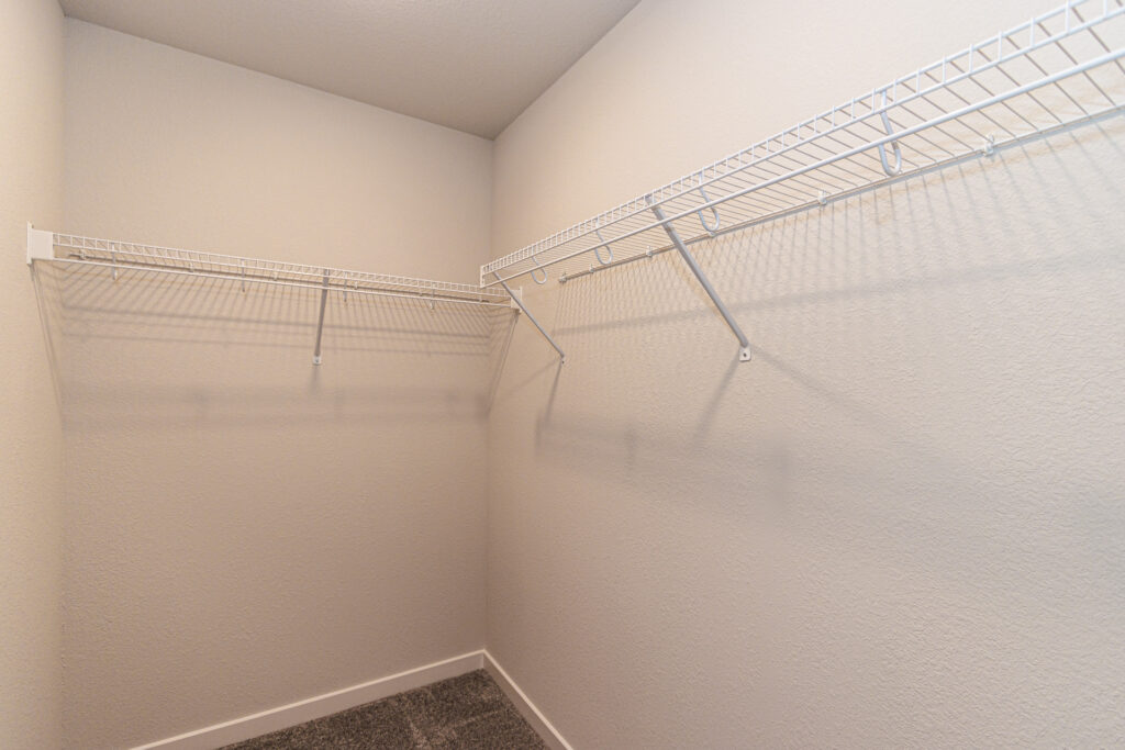 The Birch Master Closet by Stepping Stone Homes