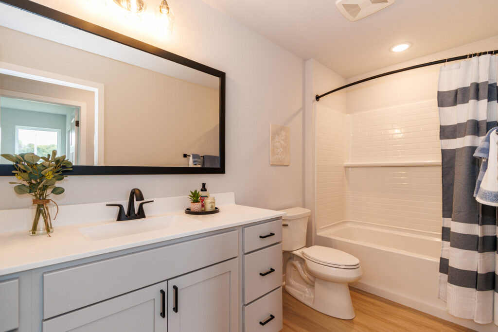 The Birch Master Bathroom by Stepping Stone Homes