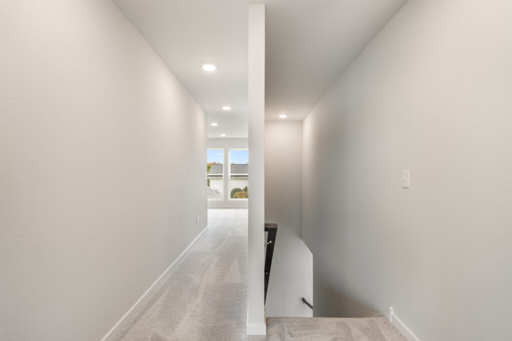 The Madison 2nd Story Hallway by Stepping Stone Homes