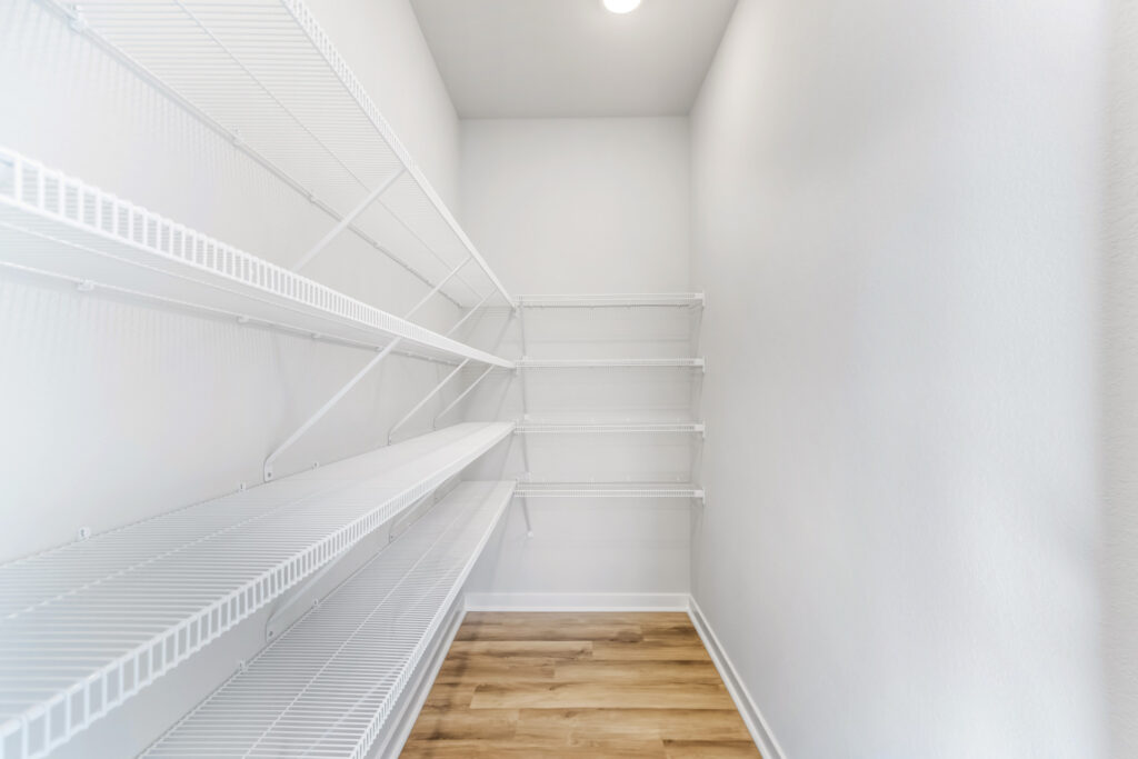 The Prescott Kitchen Walk-In Pantry by Stepping Stone Homes WI