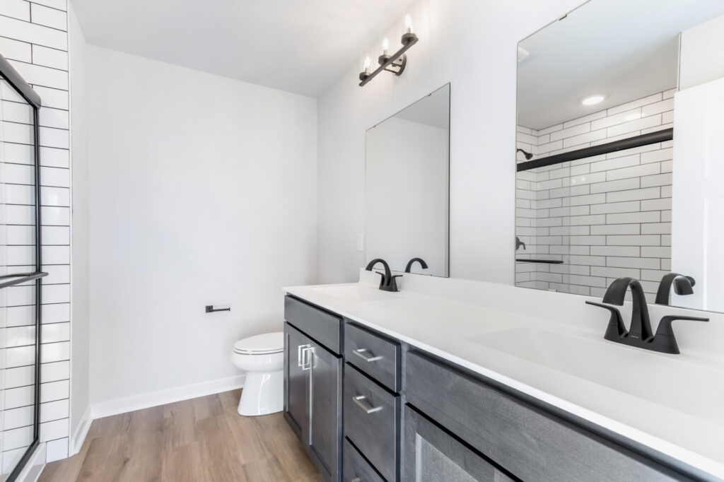 The Prescott Master Bathroom by Stepping Stone Homes WI