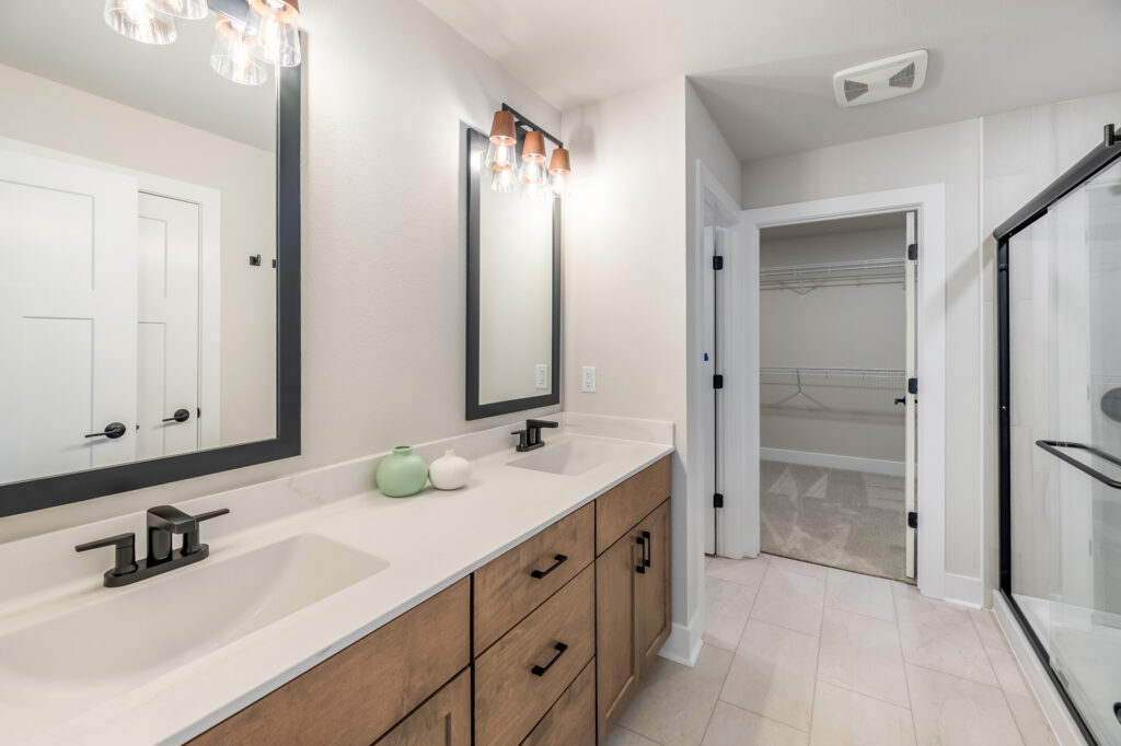 The Clara Master Bathroom by Stepping Stone Homes