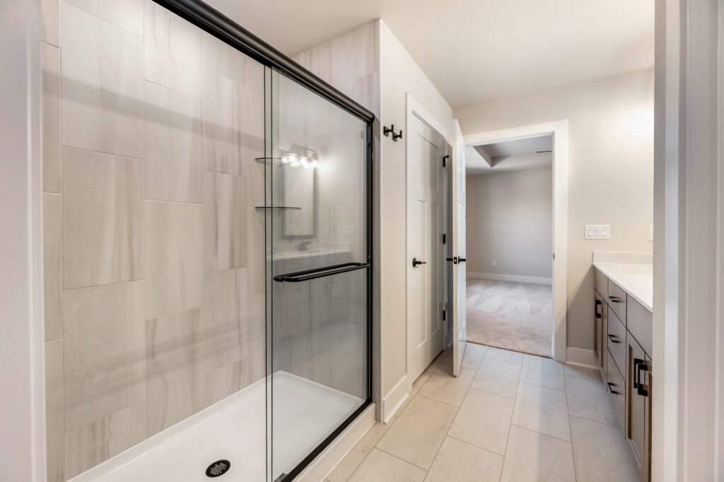 The Clara Master Bathroom by Stepping Stone Homes