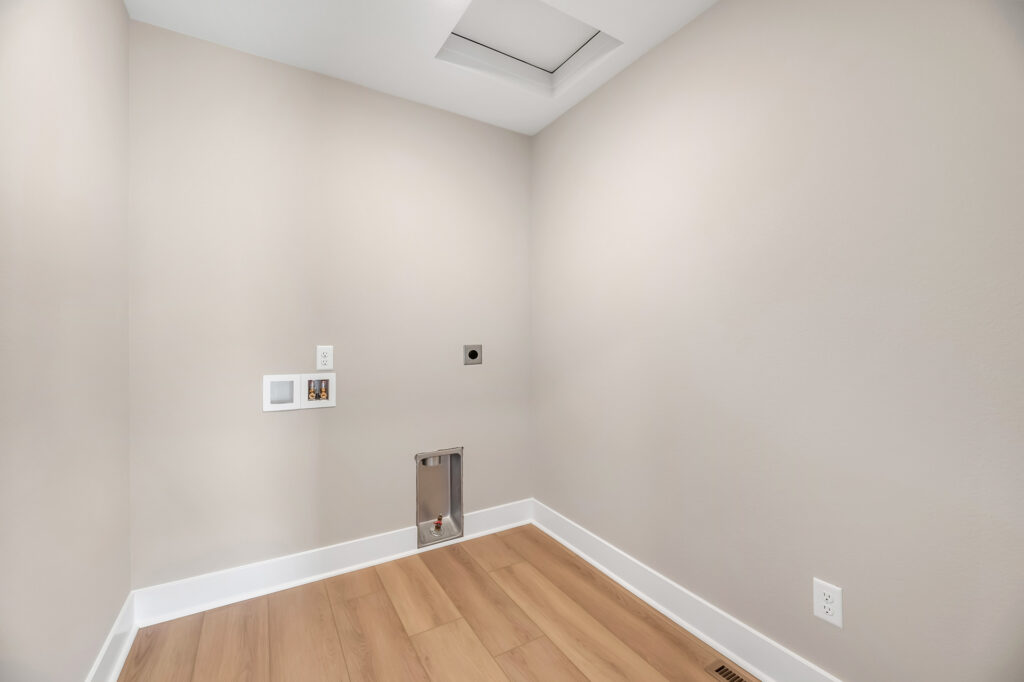 The Prescott Laundry Room by Stepping Stone Homes WI