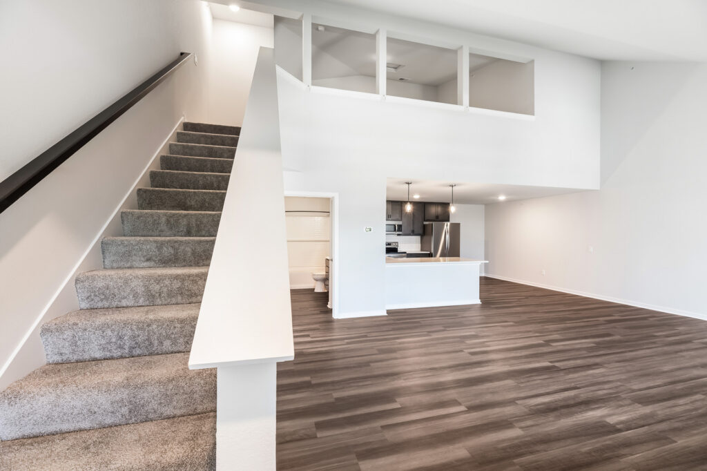 Edgewood Meadows Upper Condo Great Room by Stepping Stone Homes