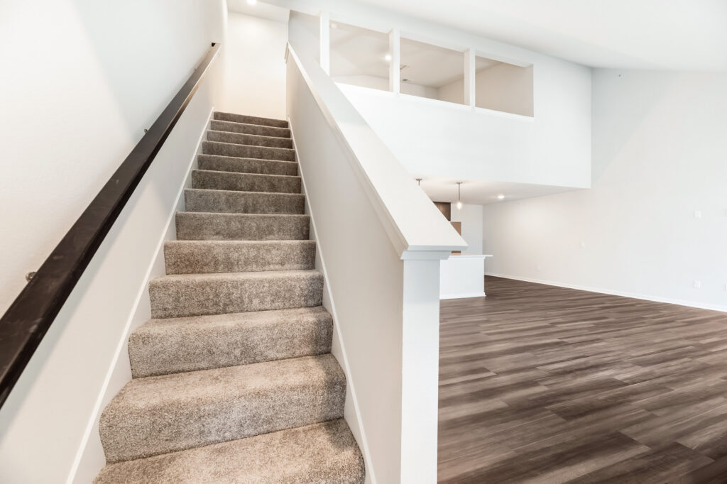 Edgewood Meadows Upper Condo Mezzanine Stairs by Stepping Stone Homes
