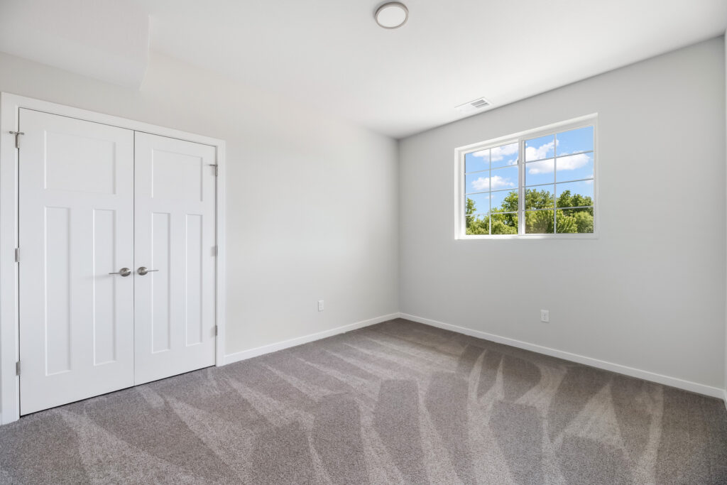 Edgewood Meadows Upper Condo Bedroom by Stepping Stone Homes