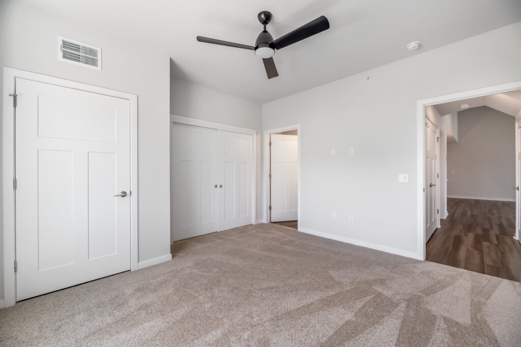 Edgewood Meadows Upper Condo Master Bedroom by Stepping Stone Homes