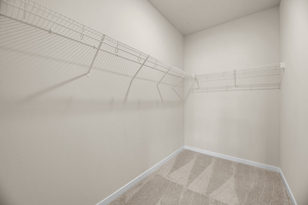 Quiet Meadows Master Closet by Stepping Stone Homes WI